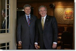 President George W. Bush and Canadian Prime Minister Stephen Harper arrive for their first meeting of the 2008 North American Leaders' Summit Monday, April 21, 2008, at the Windsor Court Hotel in New Orleans. White House photo by Joyce N. Boghosian