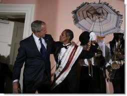 President George W. Bush shares a moment with members of the Euphonic Jazz Band Monday evening, April 21, 2008, onstage at the U.S. Chamber of Commerce prior to attending the 2008 North American Leaders’ Summit dinner in New Orleans. White House photo by Joyce N. Boghosian