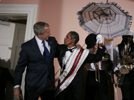 President George W. Bush shares a moment with members of the Euphonic Jazz Band Monday evening, April 21, 2008, onstage at the U.S. Chamber of Commerce prior to attending the 2008 North American Leaders’ Summit dinner in New Orleans. White House photo by Joyce N. Boghosian