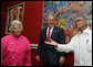 President George W. Bush is welcomed to Dooky Chase's restaurant Tuesday morning, April 22, 2008 in New Orleans, by owners Leah and Dooky Chase, where President Bush hosted a breakfast meeting with President Felipe Calderon of Mexico and Canadian Prime Minister Stephen Harper during the final day of the 2008 North American Leaders' Summit. White House photo by Joyce N. Boghosian