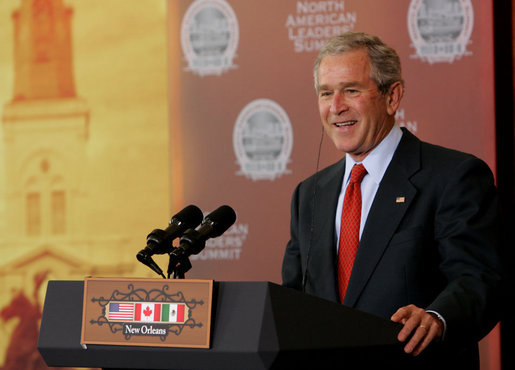 President George W. Bush smiles in response to a reporter's question at a joint news conference Tuesday, April 22, 2008, with Mexico's President Felipe Calderon and Canada’s Prime Minster Stephen Harper on the last day of the 2008 North American Leaders' Summit in New Orleans. White House photo by Chris Greenberg