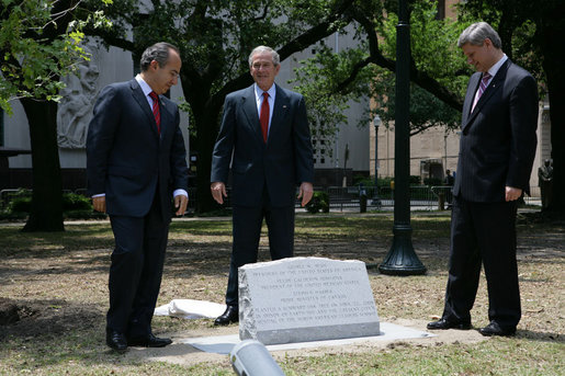 President George W. Bush joins Canadian Prime Minster Stephen Harper and Mexico’s President Felipe Calderon as they stand over a monument commemorating the leader’s tree planting in honor of Earth Day Tuesday, April 22, 2008 at Lafayette Square in New Orleans. White House photo by Chris Greenberg