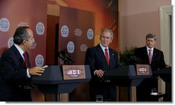 President George W. Bush and Canadian Prime Minister Stephen Harper listen to Mexico President Felipe Calderon as he responds to a reporter’s question, during their joint news conference Tuesday, April 22, 2008 in New Orleans, at the conclusion of the 2008 North American Leaders’ Summit. White House photo by Joyce N. Boghosian