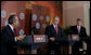 President George W. Bush and Canadian Prime Minister Stephen Harper listen to Mexico President Felipe Calderon as he responds to a reporter’s question, during their joint news conference Tuesday, April 22, 2008 in New Orleans, at the conclusion of the 2008 North American Leaders’ Summit. White House photo by Joyce N. Boghosian