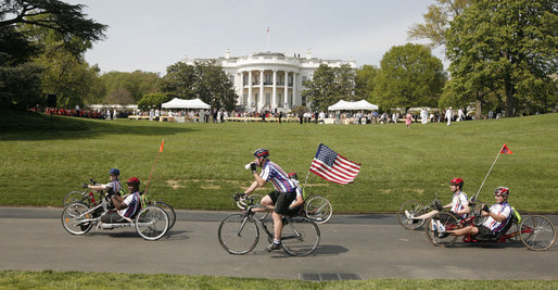 Members of the Wounded Warrior Project's Soldier Ride head around the South Lawn of the White House Thursday, April 24, 2008, during the kickoff of the annual "Soldier Ride: White House to Lighthouse Challenge" bike ride. White House photo by Joyce N. Boghosian