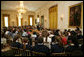 Mrs. Laura Bush and daughter, Jenna Bush, read a book to children of White House staff at Bring Your Child to Work Day Thursday, April 24, 2008, in the East Room of the White House. White House photo by Shealah Craighead