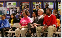 President George W. Bush joins members at the Northwest Boys & Girls Club in Hartford, Conn., Friday, April 25, 2008, during a program presentation for Malaria Awareness Day. President Bush later reviewed projects that the Boys & Girls Club members made about the prevention and treatment of malaria. White House photo by Chris Greenberg