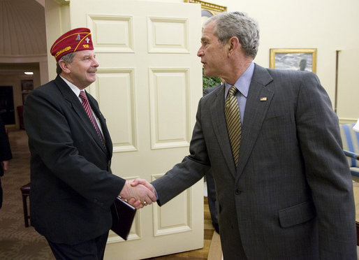 President George W. Bush shakes the hand of Marty Conatser, the National Commander of the American Legion during a courtesy visit Monday, April 28, 2008, to the Oval Office. The National Commander is the organization's highest position, elected annually at the American Legion's summer convention. White House photo by Chris Greenberg