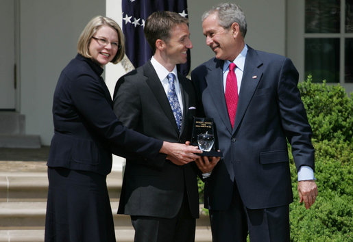 President George W. Bush smiles as he and Secretary of Education Margaret Spellings present Mike Geisen with the 2008 National Teacher of the Year honors Wednesday, April 30, 2008, in the Rose Garden of the White House. White House photo by Shealah Craighead