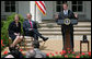 President George W. Bush and Secretary Margaret Spellings of the Department of Education, laugh as they listen to remarks by Mike Geisen, the 2008 National Teacher of the Year. Said the 35-year-old, 7th-grade science teacher from Prineville, Ore., "Each of the teachers that sits here today amongst us is here today because of their commitment and their courage to live in light of this fact: Children are fully human beings. Children are fully human beings. They're not conglomerations of hormones, they're not animals to be trained, they're not just numbers to be measured or future commodities to produce. They are our equals. They're the here and the now. And they are beautiful." White House photo by Shealah Craighead