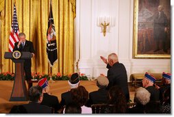 President George W. Bush salutes Tech Sgt. Ben Kuroki, of the 442nd Regiment, during his remarks Thursday, May 1, 2008, at the Celebration of Asian Pacific American Heritage Month in the East Room of the White House. Ben Kuroki, flew nearly 60 combat missions in both Europe and the Pacific. The 442nd Regimental Combat Team was a segregated Army unit composed mostly of Japanese American volunteers. They served with distinction in eight battle campaigns in Europe, and the 442nd was one of the most highly decorated units in World War II. White House photo by Joyce N. Boghosian