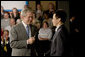 President George W. Bush takes a question from the audience following his remarks on the economy Friday, May 2, 2008, during his visit to World Wide Technology, Inc. in Maryland Heights, Mo. White House photo by Chris Greenberg