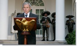 President George W. Bush welcomes guests to the Rose Garden Monday evening, May 5, 2008, for a social dinner in honor of Cinco de Mayo. White House photo by Chris Greenberg