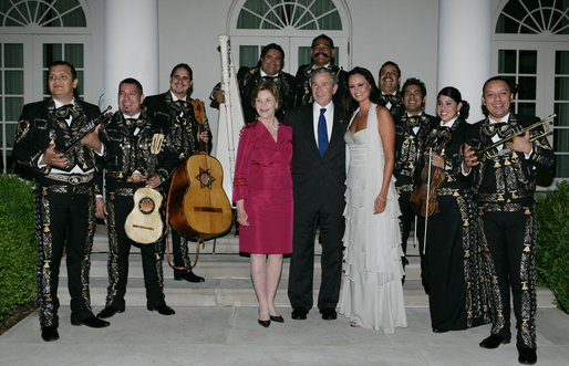 President George W. Bush and Laura Bush pose for photos with singer Shaila Durcal, Dorio Ferreira Sanchez and the Mariachi Campanas de America following their performance in the Rose Garden Monday evening, May 5, 2008, during a social dinner at the White House in honor of Cinco de Mayo. White House photo by Chris Greenberg