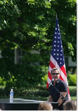 Country recording artist Phil Vassar sings the national anthem Tuesday, May 6, 2008, during Military Spouse Day celebration on the South Lawn of the White House. White House photo by Chris Greenberg