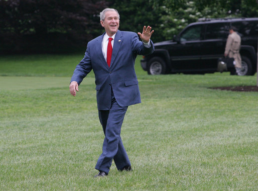 President George W. Bush smiles as he walks across the South Lawn to Marine One Thursday, May 8, 2008, en route to Andrews Air Force Base before continuing on to the Bush Ranch where he and Mrs. Laura Bush will celebrate the wedding of their daughter, Jenna, Saturday. White House photo by Joyce N. Boghosian