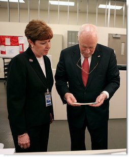 Vice President Dick Cheney examines an economic stimulus check Thursday, May 8, 2008, while on a tour of the Philadelphia Regional Financial Center with Director Betty Belinsky in Philadelphia. From May through July the Philadelphia Regional Financial Center will print over 42 million checks for disbursement to U.S. citizens as part of the Economic Stimulus Act of 2008. White House photo by David Bohrer