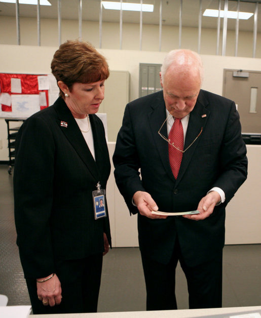 Vice President Dick Cheney examines an economic stimulus check Thursday, May 8, 2008, while on a tour of the Philadelphia Regional Financial Center with Director Betty Belinsky in Philadelphia. From May through July the Philadelphia Regional Financial Center will print over 42 million checks for disbursement to U.S. citizens as part of the Economic Stimulus Act of 2008. White House photo by David Bohrer