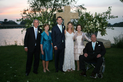 President George W. Bush and Mrs. Laura Bush and Mr. and Mrs. John Hager pose with the newly married couple, Jenna and Henry Hager, in front of the altar Saturday, May 10, 2008, after their wedding ceremony at Prairie Chapel Ranch near Crawford, Texas. White House photo by Shealah Craighead