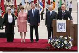 President George W. Bush and Mrs. Laura Bush are joined by Mrs. Aliza Olmert, wife of Prime Minister Ehud Olmert, and Israel’s President Shimon Peres as Israeli Prime Minister Olmert delivers remarks Wednesday, May 14, 2008, at arrival ceremonies for President and Mrs. Bush in Tel Aviv. White House photo by Chris Greenberg