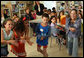 Mrs. Laura Bush looks on as second- and fifth-graders perform a Jewish and Arabic Dance at the Hand in Hand School for Jewish-Arab Education in Jerusalem. Founded in 1997, the Hand in Hand Center runs a network of four bilingual schools in Israel. White House photo by Shealah Craighead