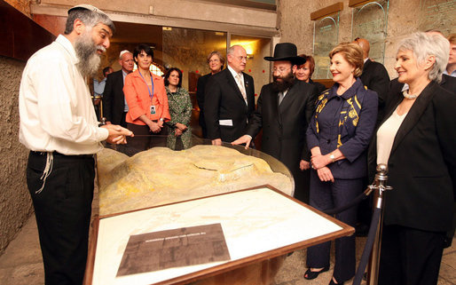 Mrs. Laura Bush and Mrs. Aliza Olmert, spouse of Israeli Prime Minister Ehud Olmert, listen to Mr. Mordechi Eliav, the Founder and Director of the Western Wall Heritage Foundation, during their visit to the Western Wall in Jerusalem Wednesday, May 14, 2008. White House photo by Shealah Craighead