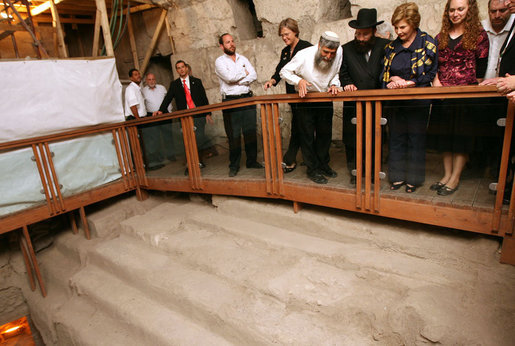 Listening to Mr. Mordechi Eliav as he describes the ongoing construction project that is the Western Wall Tunnels, Mrs. Laura Bush and Mrs. Aliza Olmert, spouse of Israeli Prime Minister Ehud Olmert, participate in a tour of the Jerusalem site. White House photo by Shealah Craighead