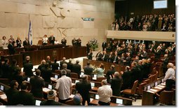 President George W. Bush receives a standing ovation by members of the Knesset Thursday, May 15, 2008, in Jerusalem. Acknowledging the 60th anniversary of Israel’s independence, the President told the Israeli parliament, “Earlier today, I visited Masada, an inspiring monument to courage and sacrifice. At this historic site, Israeli soldiers swear an oath: "Masada shall never fall again." Citizens of Israel: Masada shall never fall again, and America will be at your side.” White House photo by Shealah Craighead