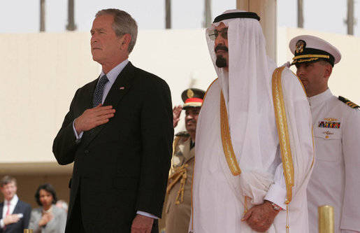 President George W. Bush and King Abdullah bin Adbulaziz pause for the playing of their respective national anthems Friday, May 16, 2008, during arrival ceremonies for the President and Mrs. Laura Bush at Riyadh-King Khaled International Airport in Riyadh. White House photo by Joyce N. Boghosian