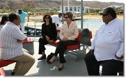 Mrs. Laura Bush listens to Dr. Mohamed Salem, Head of the South Sinai Protectorates, Egyptian Environmental Affairs Agency, as they prepare to depart for a coral reefs and ocean conservation tour Saturday, May 17, 2008, in Sharm El Sheikh, Egypt. Joining them are Ms. Hilda Arellano, USAID Cairo Mission Director, and Mr. Amir Ali, Hurghada Environmental Protection and Conservation Association. White House photo by Shealah Craighead