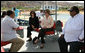 Mrs. Laura Bush listens to Dr. Mohamed Salem, Head of the South Sinai Protectorates, Egyptian Environmental Affairs Agency, as they prepare to depart for a coral reefs and ocean conservation tour Saturday, May 17, 2008, in Sharm el Sheikh, Egypt. Joining them are Ms. Hilda Arellano, USAID Cairo Mission Director, and Mr. Amir Ali, Hurghada Environmental Protection and Conservation Association. White House photo by Shealah Craighead