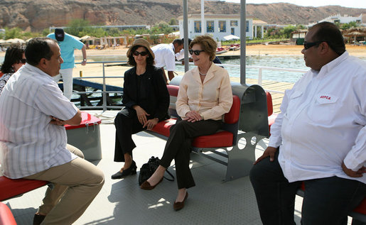 Mrs. Laura Bush listens to Dr. Mohamed Salem, Head of the South Sinai Protectorates, Egyptian Environmental Affairs Agency, as they prepare to depart for a coral reefs and ocean conservation tour Saturday, May 17, 2008, in Sharm El Sheikh, Egypt. Joining them are Ms. Hilda Arellano, USAID Cairo Mission Director, and Mr. Amir Ali, Hurghada Environmental Protection and Conservation Association. White House photo by Shealah Craighead