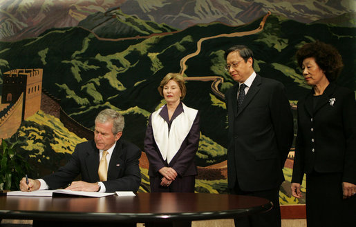 President George W. Bush signs his condolences for the victims of China's May 12 earthquake as he and Mrs. Laura Bush visit the Embassy of the People's Republic of China Tuesday, May 20, 2008, in Washington, D.C. With them are China's Ambassador to the United States Wenzhong Zhou and his spouse, Shumin Xie. White House photo by Joyce N. Boghosian