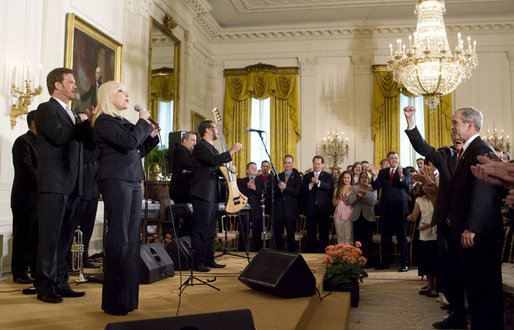 President George W. Bush stands for the Cuban national anthem Wednesday, May 21, 2008, during a Day of Solidarity with the Cuban People in the East Room of the White House. Scheduled to coincide with a period in Cuban history that marks Cuban Independence Day, the death of Jose Marti and the death of Pedro Luis Boitel, the day seeks to focus international attention on the denial of fundamental freedoms to the Cuban people. White House photo by Joyce N. Boghosian