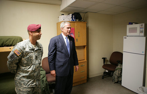 President George W. Bush is given a tour of a 82nd Airborne Division barracks room by 1st Sgt. David Santos, during the President's visit Thursday, May 22, 2008 in Fort Bragg, N.C., for the 82nd Airborne Division review. White House photo by Chris Greenberg