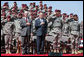 President George W. Bush and U.S. Army Secretary Pete Geren stand during the playing of the National Anthem Thursday, May 22, 2008 in Fort Bragg, N.C., for the 82nd Airborne Division Review. White House photo by Chris Greenberg