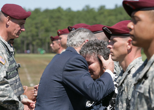 President George W. Bush embraces Barbara Walsh, mother of Sgt. First Class Benjamin Sebban, after receiving her son's posthumous Silver Star for gallantry presented by President Bush Thursday, May 22, 2008, during ceremonies at the 82nd Airborne Division Review in Fort Bragg, N.C. Sgt. First Class Sebban served valiantly as a Senior Medic in support of Operation Iraqi Freedom. White House photo by Chris Greenberg