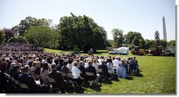 Speaking from the South Lawn with a backdrop of American-made products, President George W. Bush delivers remarks in recognition of World Trade Week Friday, May 23, 2008, at the White House. White House photo by Eric Draper