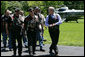 President George W. Bush shares a laugh with National Executive Director of Rolling Thunder Artie Muller as he escorts a group of the motorcyle riders to the Oval Office. White House photo by Chris Greenberg