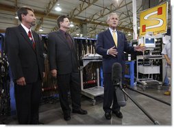 President George W. Bush delivers a statement to the media following his tour of the production floor at the Silverado Cable Company in Mesa, Arizona, Tuesday, May 27, 2008. Also pictured are Bob Simpson Jr. President of Silverado Cable Company and Mitch Simpson, Vice President of Silverado Cable Company. White House photo by Eric Draper