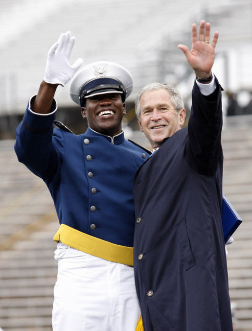 President George W. Bush celebrates with an unidentified graduate Wednesday, May 28, 2008, during commencement exercises at the United States Air Force Academy in Colorado Springs. White House photo by Eric Draper