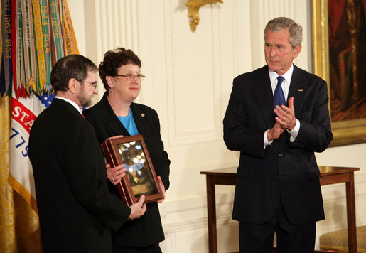 President George W. Bush leads the applause in honor of Private First Class Ross A. McGinnis, U.S. Army, after presenting the Congressional Medal of Honor posthumously to his parents, Tom and Romayne McGinnis, of Knox, Pennsylvania, during ceremonies Monday, June 2, 2008, at the White House. White House photo by Chris Greenberg