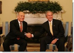 President George W. Bush and Prime Minister Ehud Olmert of Israel, shake hands during a photo opportunity prior to their meeting Wednesday, June 4, 2008, at the White House. White House photo by Joyce N. Boghosian