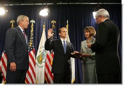 President George W. Bush looks on as White House Chief of Staff Joshua Bolten administers the oath of office to Secretary of Housing and Urban Development Steve Preston, Friday, June 6, 2008 in Washington, D.C. Holding the Bible for the ceremonial swearing-in is Molly Preston, wife of Secretary Preston. White House photo by Joyce N. Boghosian