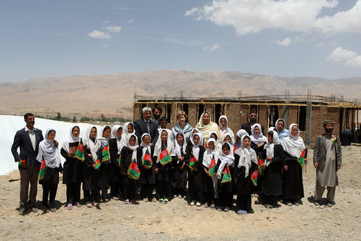 Mrs. Laura Bush is joined by Habiba Sarabi, Governor of Bamiran Province, right, and students of the Ayenda Learning Center Sunday, June 8, 2008, during a tour of the school's construction site in Bamiyan, Afghanistan. White House photo by Shealah Craighead