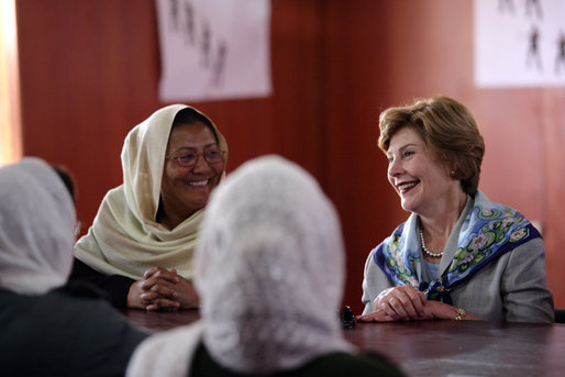 Mrs. Laura Bush smiles as she meets Sunday, June 8, 2008, with female graduates of the Police Training Academy in Bamiyan province in Afghanistan. With her is Bamiyan Governor Habiba Sarabi. White House photo by Shealah Craighead