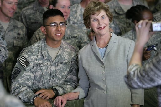 Mrs. Laura Bush poses for a photo with a US soldier during her visit to Bagram Air Force Base Sunday, June 8, 2008, in Bagram, Afghanistan. White House photo by Shealah Craighead