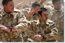 New Zealand soldiers perform a traditional warrior’s dance Sunday, June 8, 2008, during a welcoming ceremony for Mrs. Laura Bush at the Bamiyan Provincial Reconstruction Team Base in Afghanistan’s Bamiyan province. White House photo by Shealah Craighead