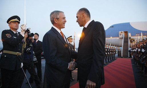 President George W. Bush and Slovenia's Prime Minister Janez Jansa shake hands as President Bush prepared to depart Ljubljana International Airport Monday, June 9, 2008, for nearby Kranj after arriving in the central European country on the first leg of his weeklong visit to the continent. White House photo by Eric Draper