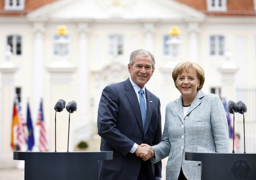 President George W. Bush and Germany's Chancellor Angela Merkel shake hands after participating in a joint press availability Wednesday, June 11, 2008, at Schloss Meseberg in Meseberg, Germany. White House photo by Eric Draper